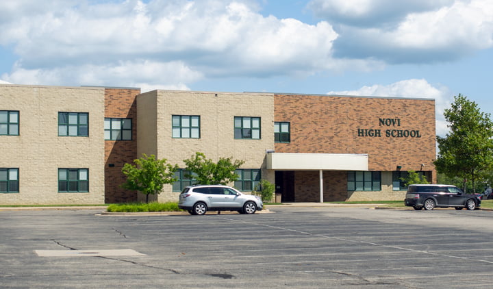 Front entrance to Novi High School in Oakland County, Michigan. The facility is a two story brick building