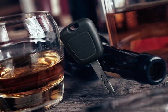 Glass of alcohol next to car keys indicating the DUI and OWI defense practice area