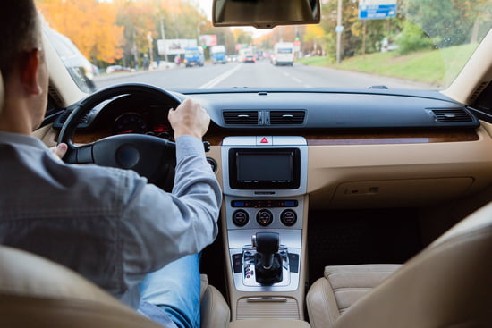 Man driving a car with an ignition interlock device required to start the vehicle indicating the license restoration practice area