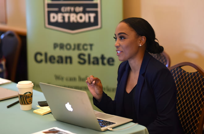 Attorney Kyona McGhee of Project Clean Slate, assist clients in the expungement process for criminal offenses at the Fiat Chrysler Automobiles hiring event.