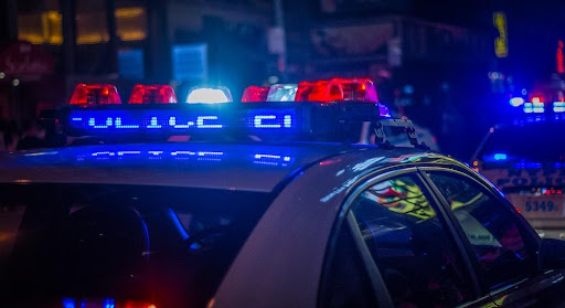Featured: Police cars with flashing lights at side of road- What to Do When the Police Question You