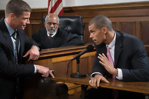 Featured: Defendant being cross-examined in court by lawyer pointing to evidence- Perjury