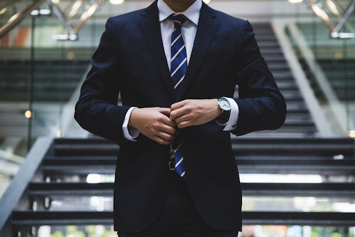 Featured: Man on steps in blue suit- Can I Represent Myself in a Criminal Case?